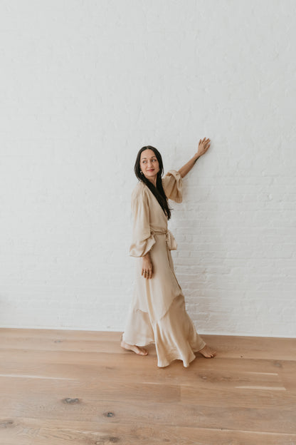 women wearing Ethical silk wrap dress with symbolic embroidery

