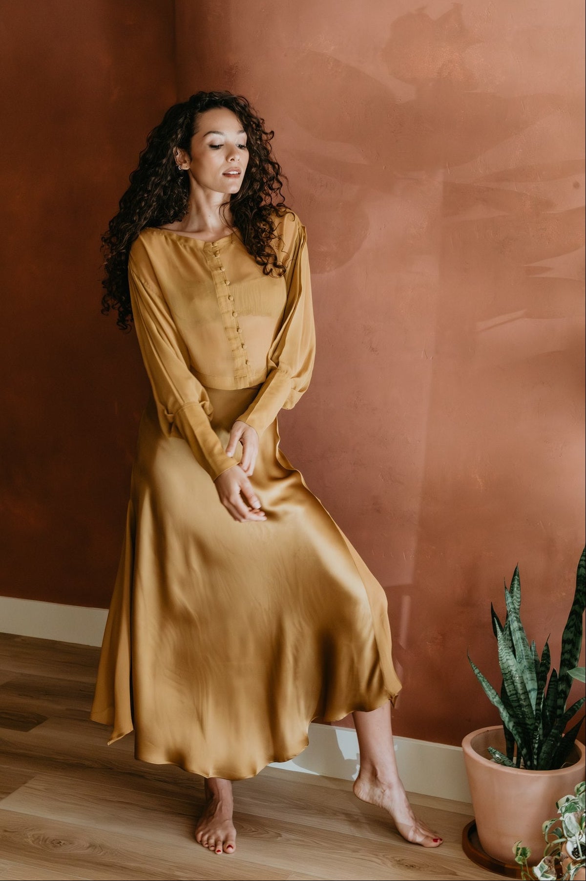 women wearing Aura Skirt in Brass Viscose satin 