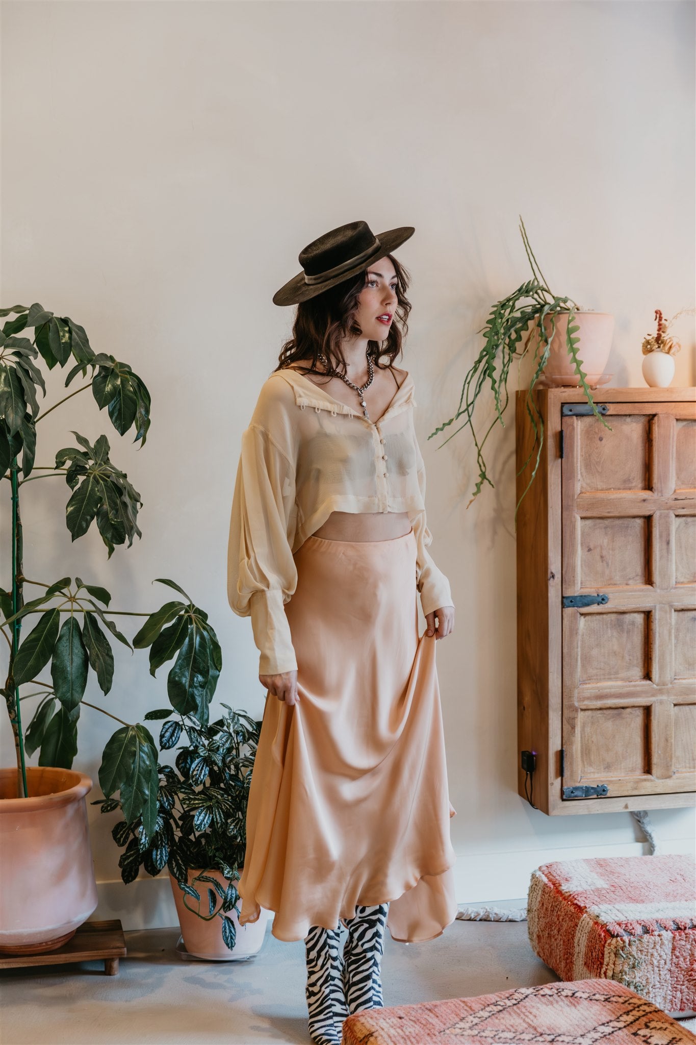 women wearing champagne silk blouse button front soft feminine look