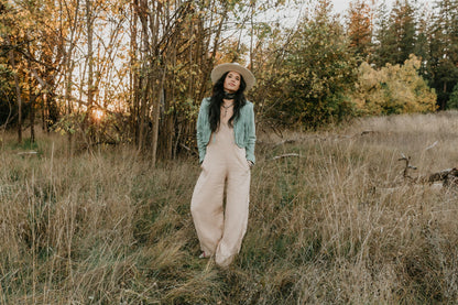 women wearing sustainable linen jumpsuit earthy tone wide leg