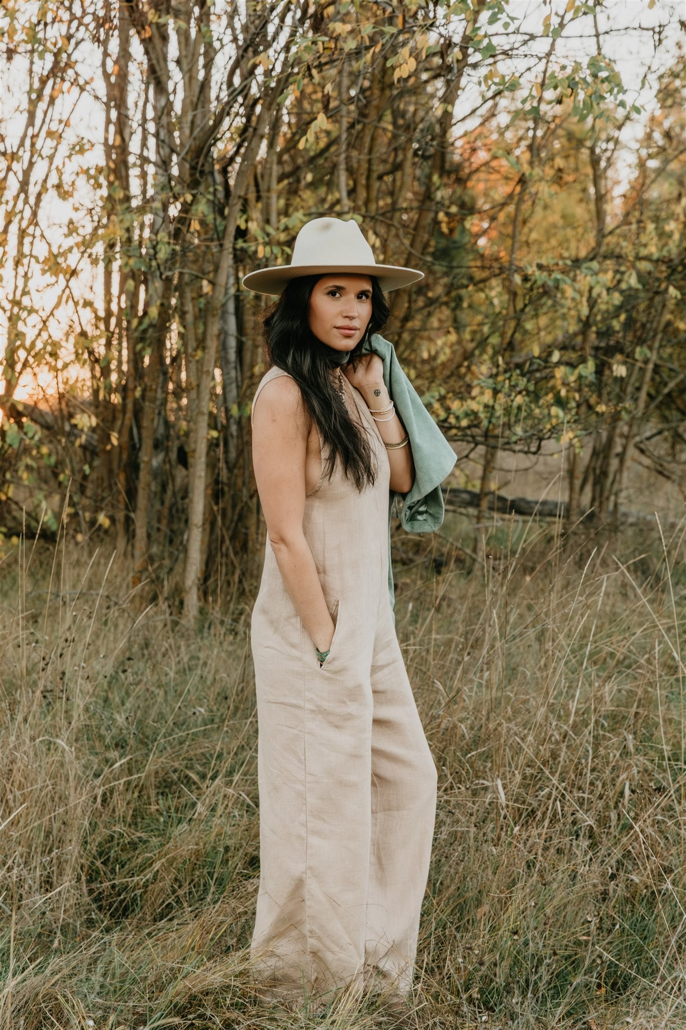 women wearing relaxed linen jumpsuit with hidden pockets outdoors