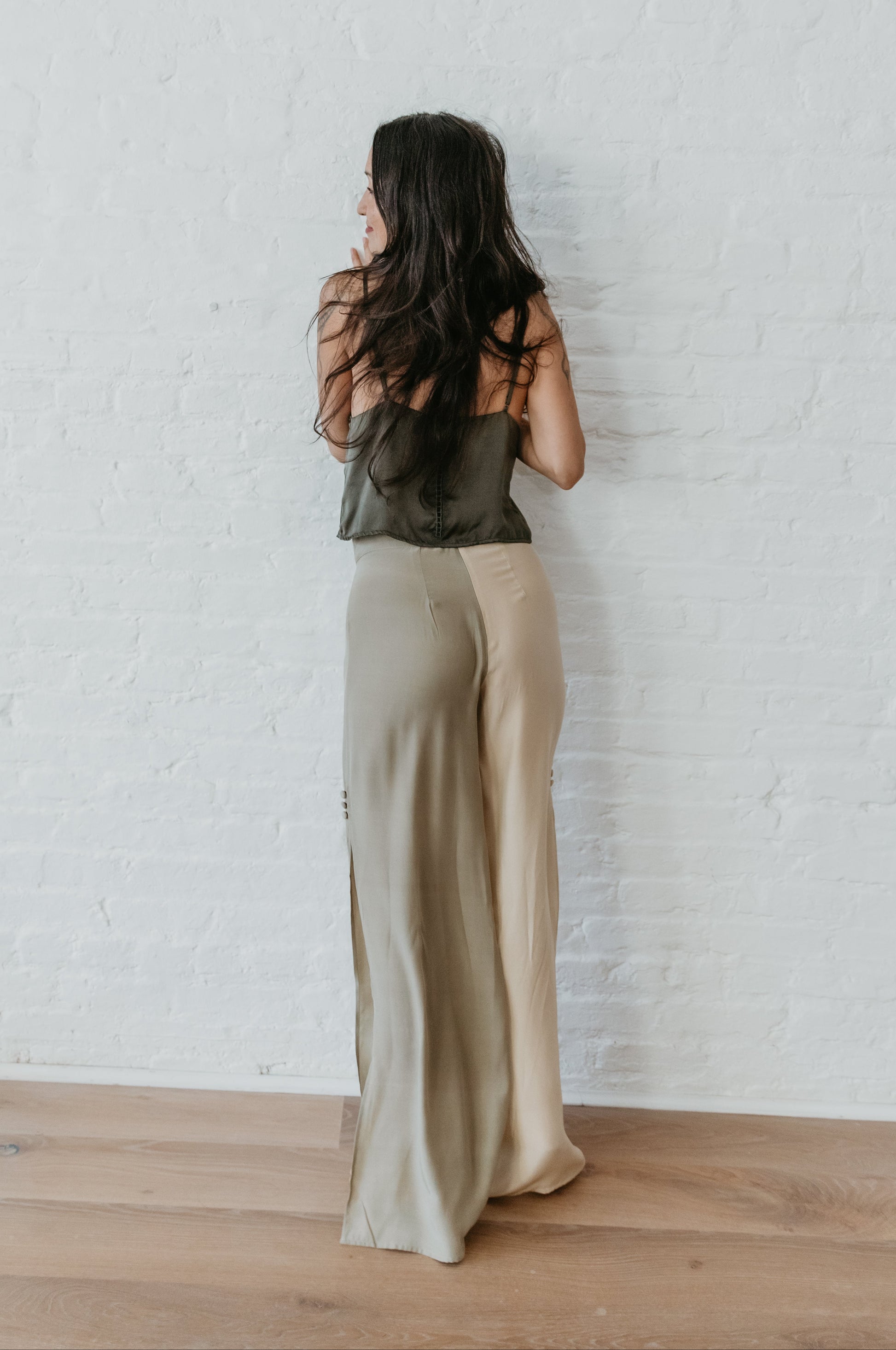 women wearing Luxury silk pants in earthy sage and light champagne
PAYET silk pants with fluid drape and soft sheen