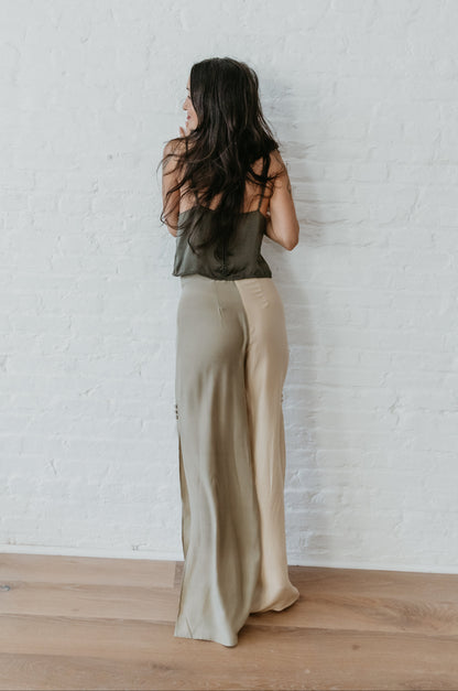 women wearing Luxury silk pants in earthy sage and light champagne
PAYET silk pants with fluid drape and soft sheen
